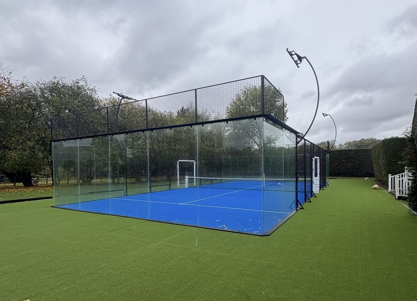 Professional padel court in Singapore - modern glass-walled venue